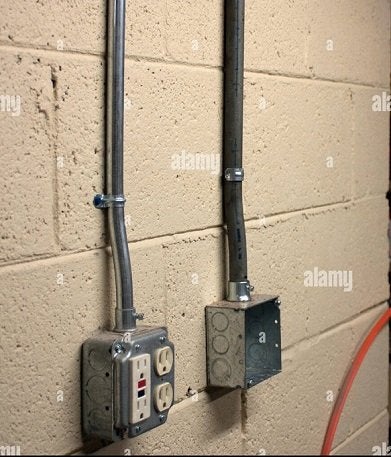 https://www.diychatroom.com/attachments/electricity-outlet-boxes-with-conduit-on-painted-cinderblock-wall-k2p77c-jpg.670264/